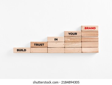 The Message Build Trust In Your Brand On Wooden Block Ladder. Business Successful Marketing, Branding And Customer Brand Awareness Concept.