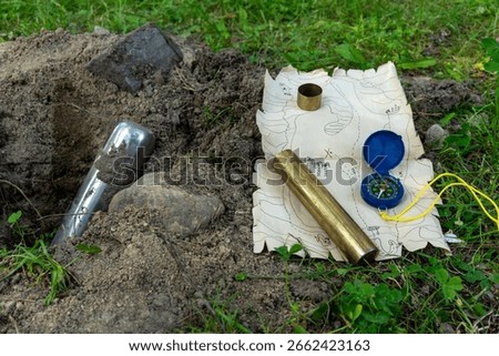 A message for future generations in a bottle.A time capsule game with a child.Find the treasure with the help of a children's treasure map.