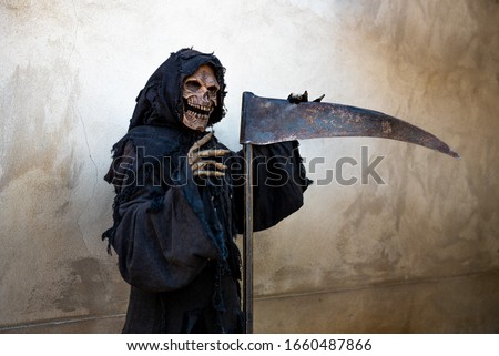 Message of Grim Reaper leaning against a scythe