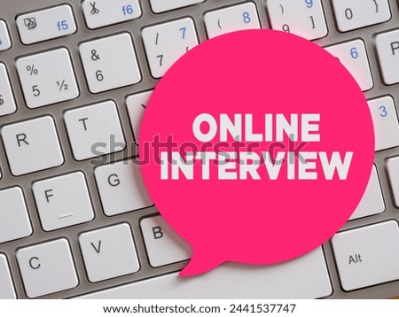 The message online interview on speech bubble over computer keyboard. Online job interview concept.