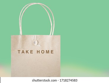 Message take home on papaer bag with pastel green background