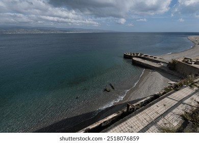 Messina, Italy - Messina's Undeveloped Beach, Offering a Simple Shoreline with No Recreational Infrastructure in Place. - Powered by Shutterstock