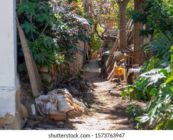 A messy alley at the colonial town of Villa de Leyva, in the Central Boyacá Province, part of the Colombian Department of Boyacá. - Powered by Shutterstock