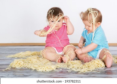Messy Baby Toddlers Having Fun Eating Pasta