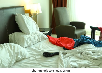 Messy Bed In The Morning Of A Hotel Room