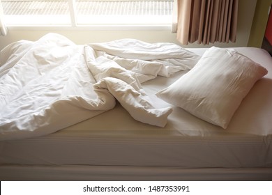 Messy Bed With Window View. Top To Down View. Concept Of Relaxation In Morning Time. Warm Color Tone With Color Light Effect.