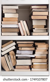 Messy Books On A Bookshelf