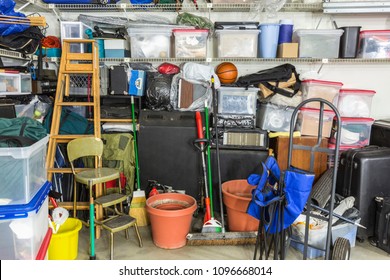 Messy cluttered garage filled with various household storage items. - Shutterstock ID 1096668014
