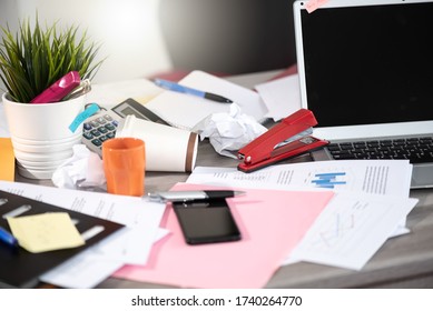 Messy And Cluttered Office Desk