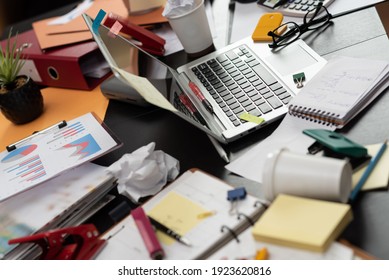 Messy And Cluttered Office Desk