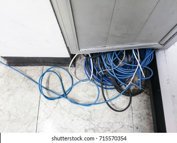 Messy Of Computer Cable,network Cable Down On The Floor In Office. Unsafe Concept.  