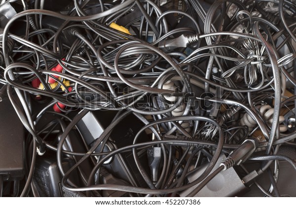 messy drawer full of wires and cables  in a\
complete disorder