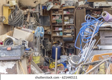 A Messy Garage Detail Filled With Various Things...