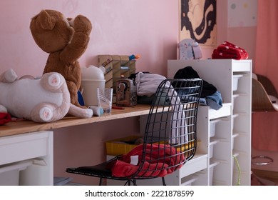 A Messy Kid Work Table And Its Surroundings