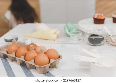 Messy Kitchen With Homemade Birthday Cake Made From Kids. Kitchen With Ingredients For Baking On Working Table. Messy Table Full With Pastries Items And Ingredients.