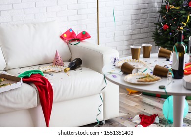 Messy Living Room Interior With Christmas Tree. Chaos After Party