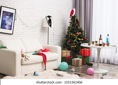 Messy Living Room Interior With Christmas Tree. Chaos After Party