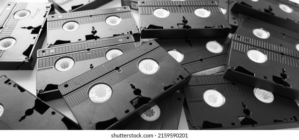 Messy Stack Of VHS Tapes. Video Home System Tape Cassettes.