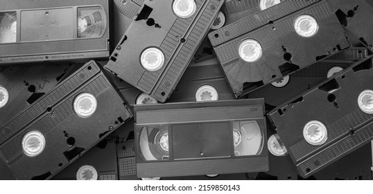 Messy Stack Of VHS Tapes. Video Home System Tape Cassettes.