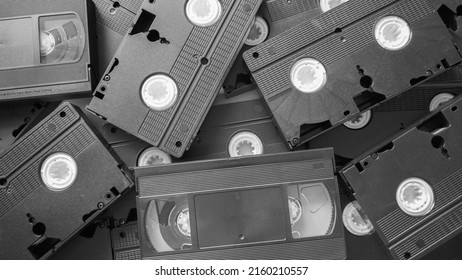 Messy Stack Of VHS Tapes. Video Home System Tape Cassettes.