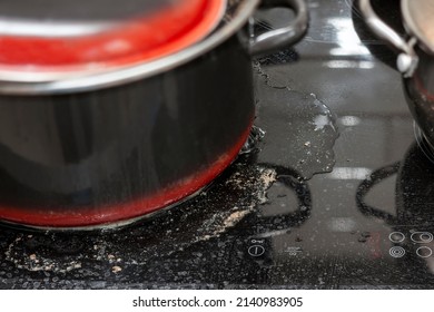 A Messy Stove Top With A Casserole And Spilled Soup, Indoor Closeup