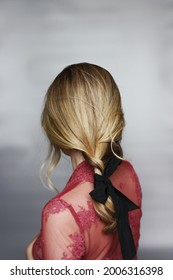 Messy Stylish Blonde Braided Hairdo With Black Hair Tie