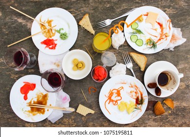 Messy Table After Party. Leftover Food, Spilled Drinks, Dirty Dishes. 