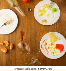 Messy Table After Party. Leftover Food, Spilled Drinks, Dirty Dishes. Top View. 