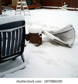 A Messy Yard With Household Stuff After Blizzard