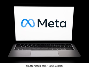 META (rebranded Facebook) company logo seen on laptop in a dark room. New Facebook logotype for METAVERSE. Stafford, United Kingdom, October 28, 2021.