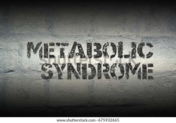 metabolic syndrome phrase stencil print on the\
grunge white brick\
wall