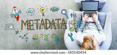 Metadata text with man using a laptop in a modern gray chair 