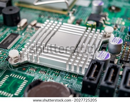 Metal aluminum radiator on the motherboard of a desktop computer, server, printed circuit board, electronic board, cooling