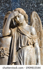 Metal Angel Statue In A Lonely Cemetery In Spain