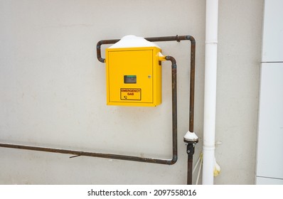 Metal Anti Vandal Box With Natural Gas Meter Gauge And Pipeline On The Wall. Gas Distribution For Heating Apartments In Winter.