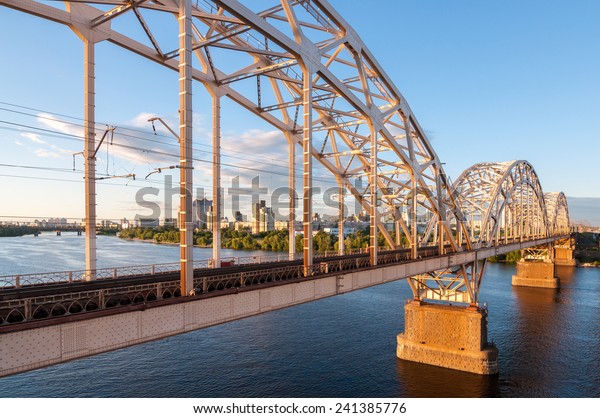 Metal arch bridge\
for cars and trains. Metal bridge across the river.metal bridge for\
cars and trains