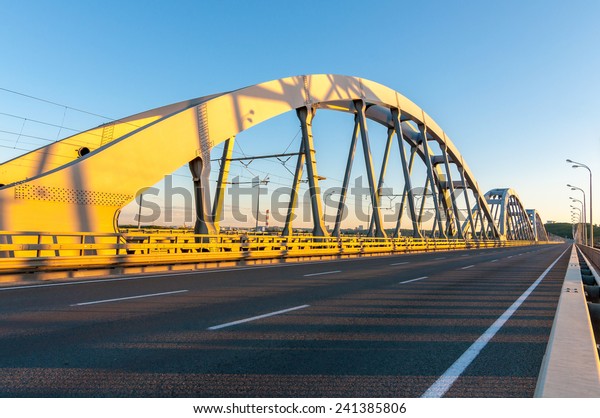 Metal arch bridge
for cars and trains. Metal bridge across the river.metal bridge for
cars and trains