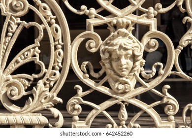 Metal Art Decco Detail Of The Railing With Ornaments And Girl Face