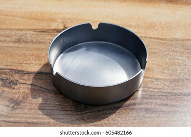 metal ashtray on the table - Shutterstock ID 605482166