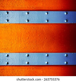 A Metal Background With A Strip Of Rivets