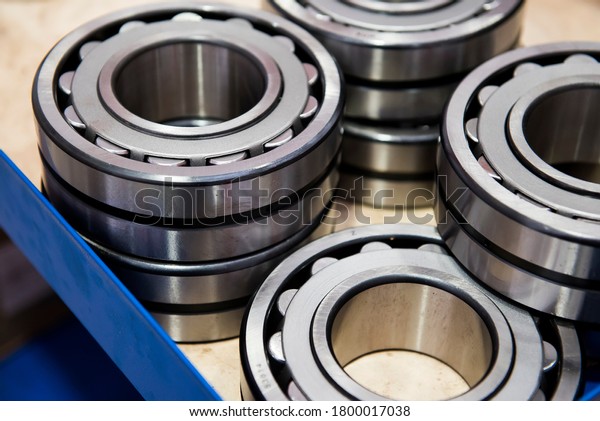 metal\
ball bearings are lying on the table in\
production