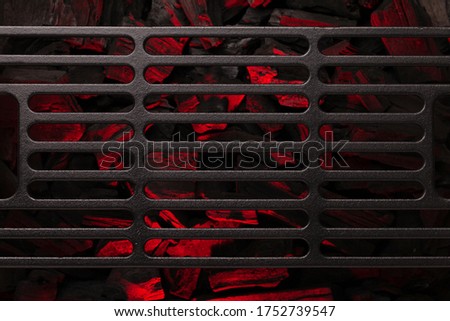 Metal barbecue grill over hot coal. Top view flat lay. Backdrop for your cooking food