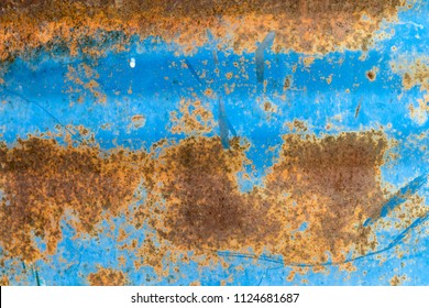 Metal Barrel With Blue Paint And Rust