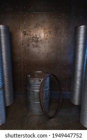 metal barrel with industrial background