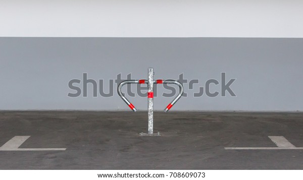Metal barrier for\
private parking in a\
garage