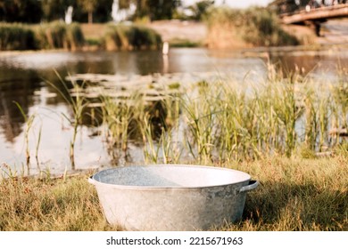 Metal Basin Near The Lake On A Sunny Summer Day