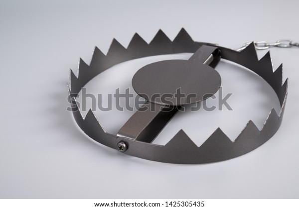 Metal bear trap. Business concept idea.\
Situations, risk setting.