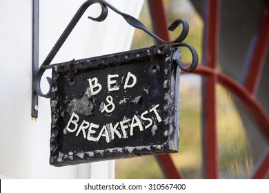 Metal Bed And Breakfast Sign On Building 