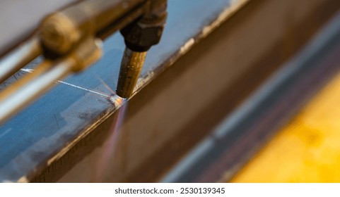 Metal being cut with a torch. Gas cutting metal. Precision and control in metal fabrication process. Sparks fly as flame. Clean, sharp cut. Metalwork and welding. Industrial metal cutting process. - Powered by Shutterstock