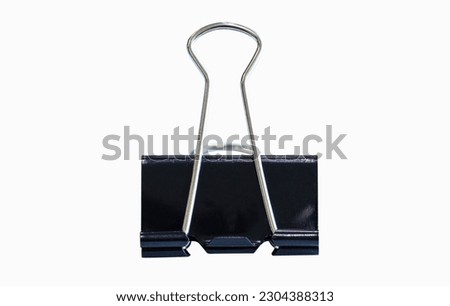 Metal Black Paper clip big isolated on white background. For use in clamping multiple sheets of paper together. May be coated or uncoated. Office equipment or school equipment.